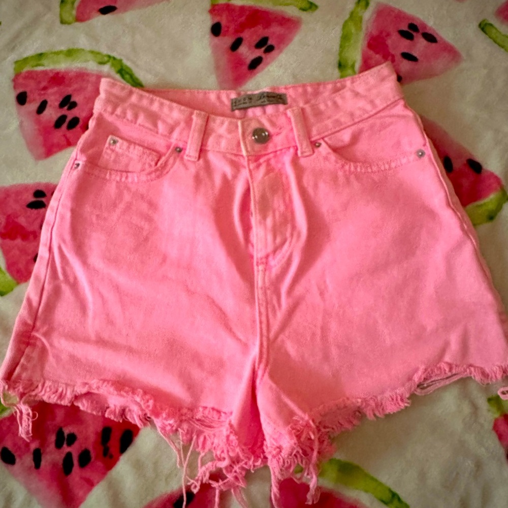 Neon pink cut off shorts